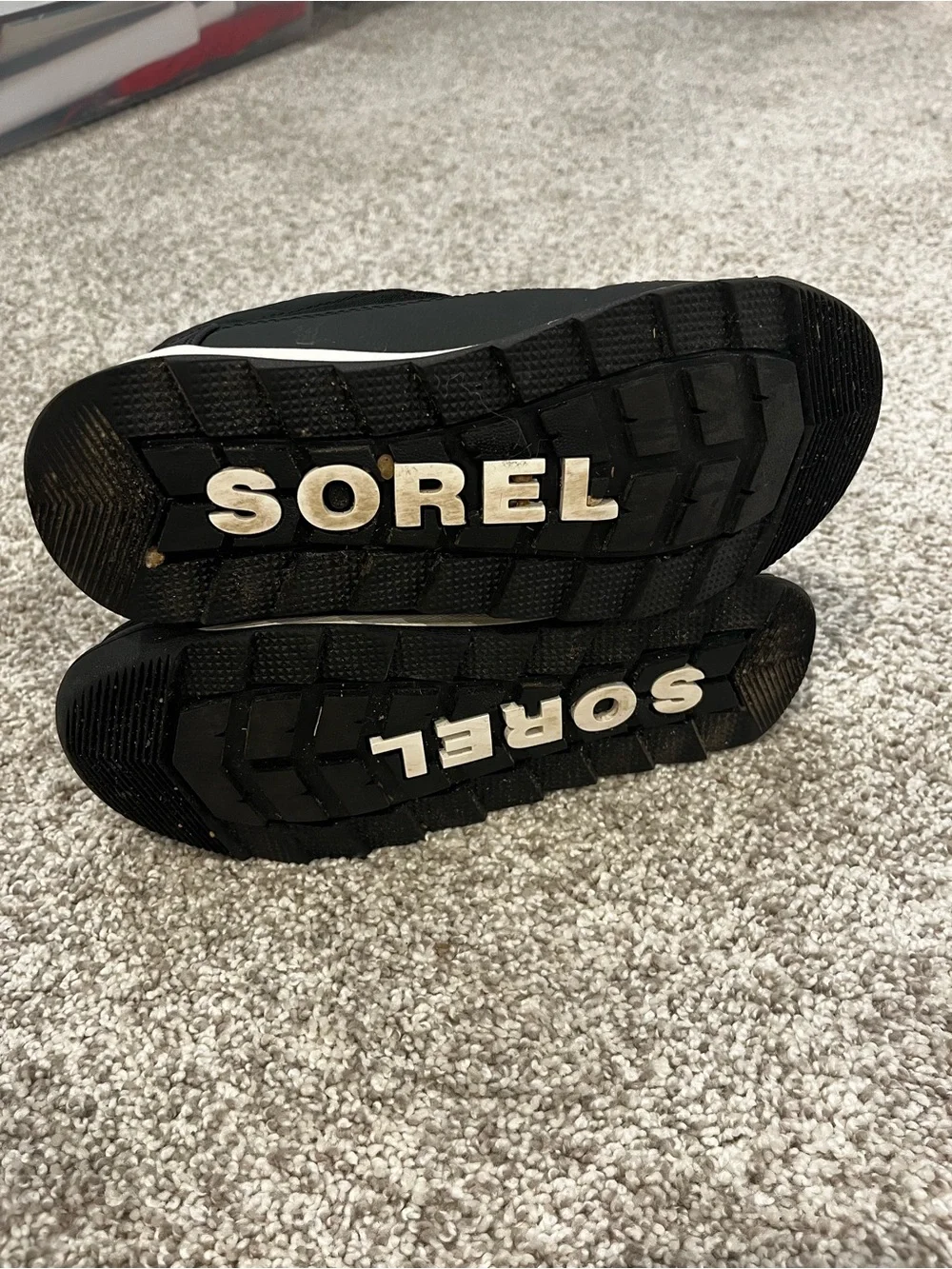 Sorel Kids Black Snow Boots with Red Lace Accents